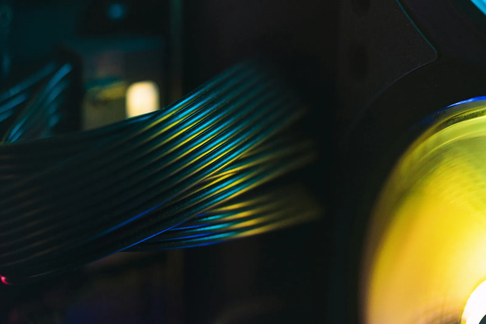 Close-up of a computer processor and its surrounding cabling inside an open workstation case, lit by diffused indoor light.